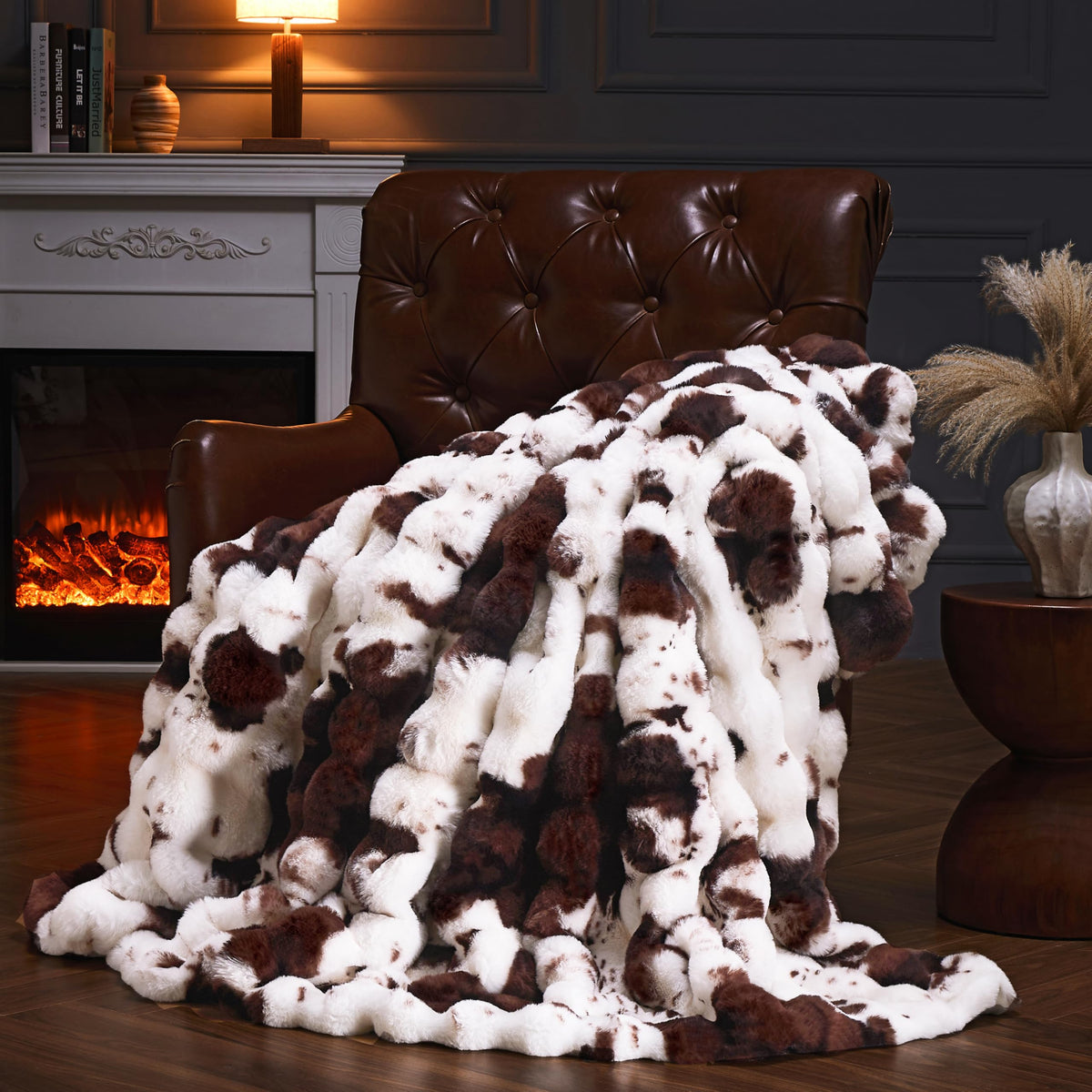 PLUUSHUU faux fur throw blanket in cow print brown for cozy sofa warmth.