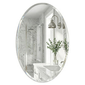 Pocetry 20x28 frameless oval mirror front view enhances compact bathroom space.