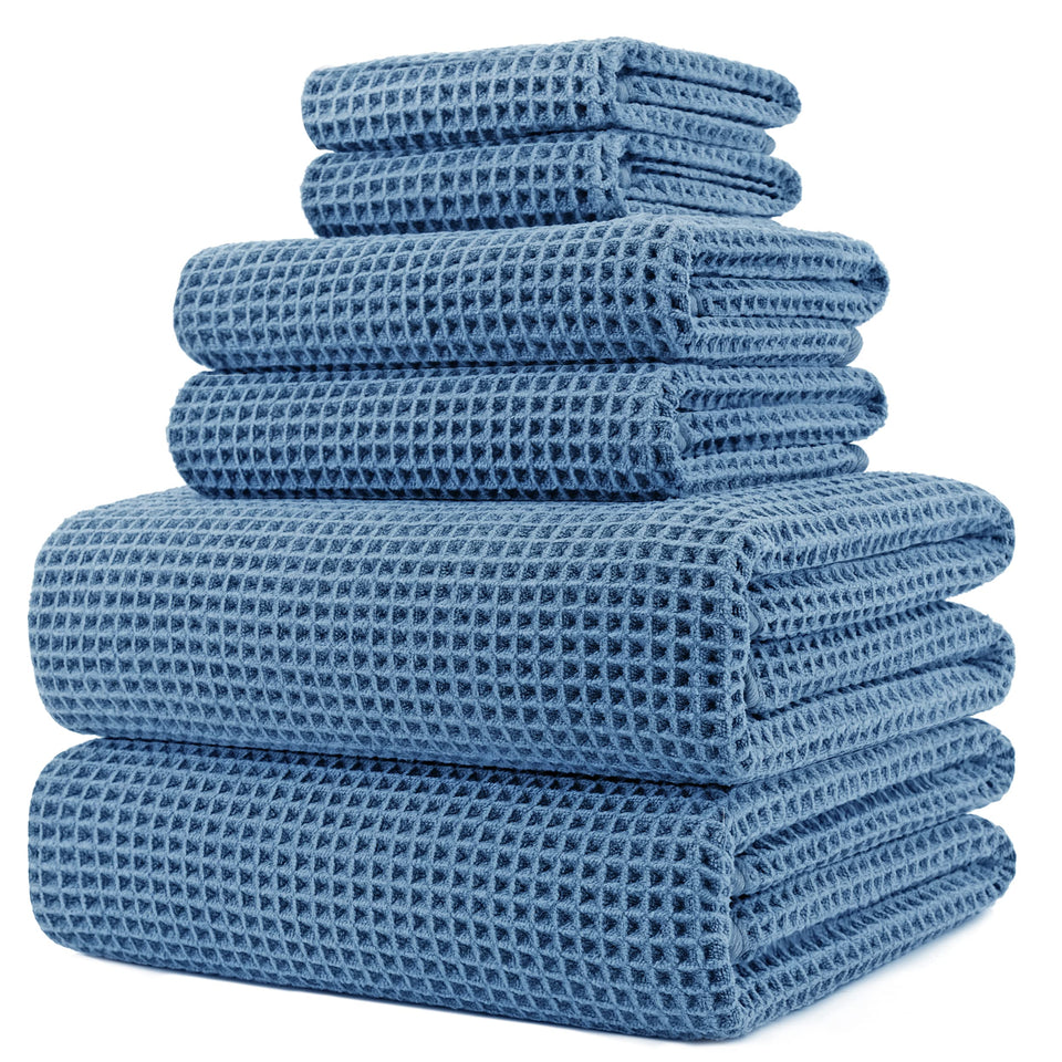 POLYTE waffle weave bath towel set flat lay for spa-like at-home use.