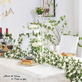 Ponking white rose heads close-up highlight delicate blooms perfect for wedding arches.