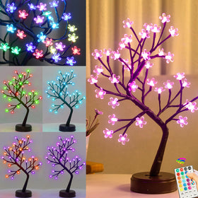 Pooqla RGB Cherry Blossom Tree Light with Remote on a stylish table showing ambient color.