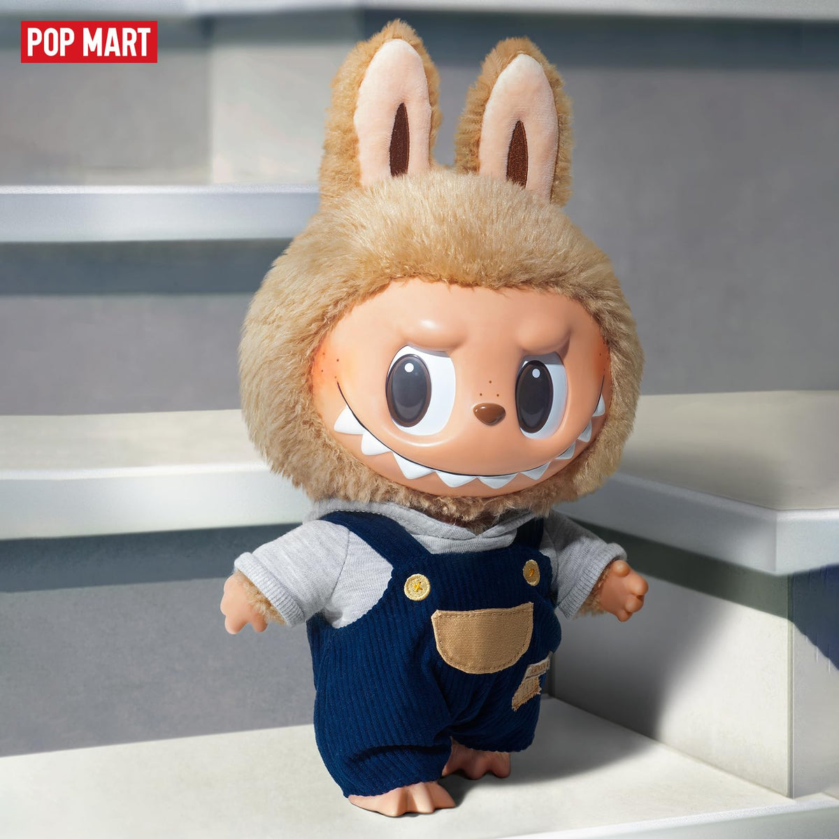 Labubu vinyl plush doll perched on a desk adds whimsy.