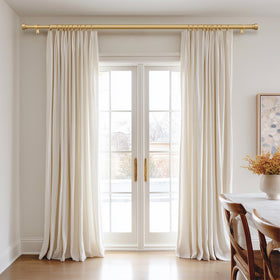 PORTRES Gold end cap finials add a modern decorative touch