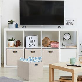 Posprica beige foldable cube storage bin collapsed for compact storage.