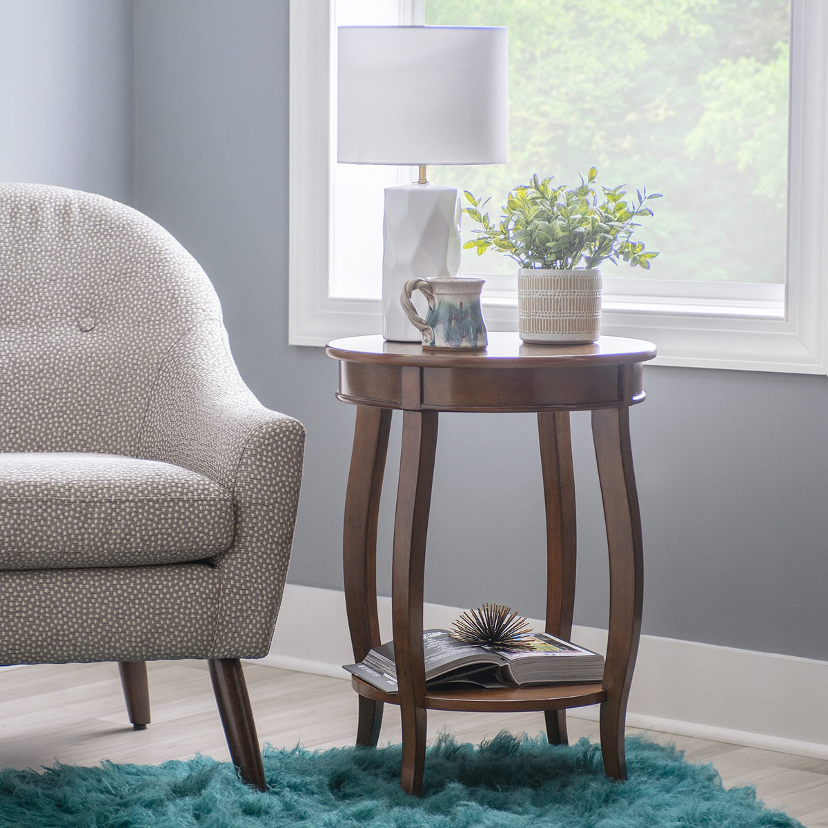 Powell Hazelnut round shelf table side view with elegant cabriole legs