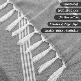 Grey and white Turkish towels offer soft, lightweight comfort and quick drying.