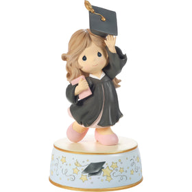 Precious Moments graduation musical cap toss figurine enhances graduation décor.