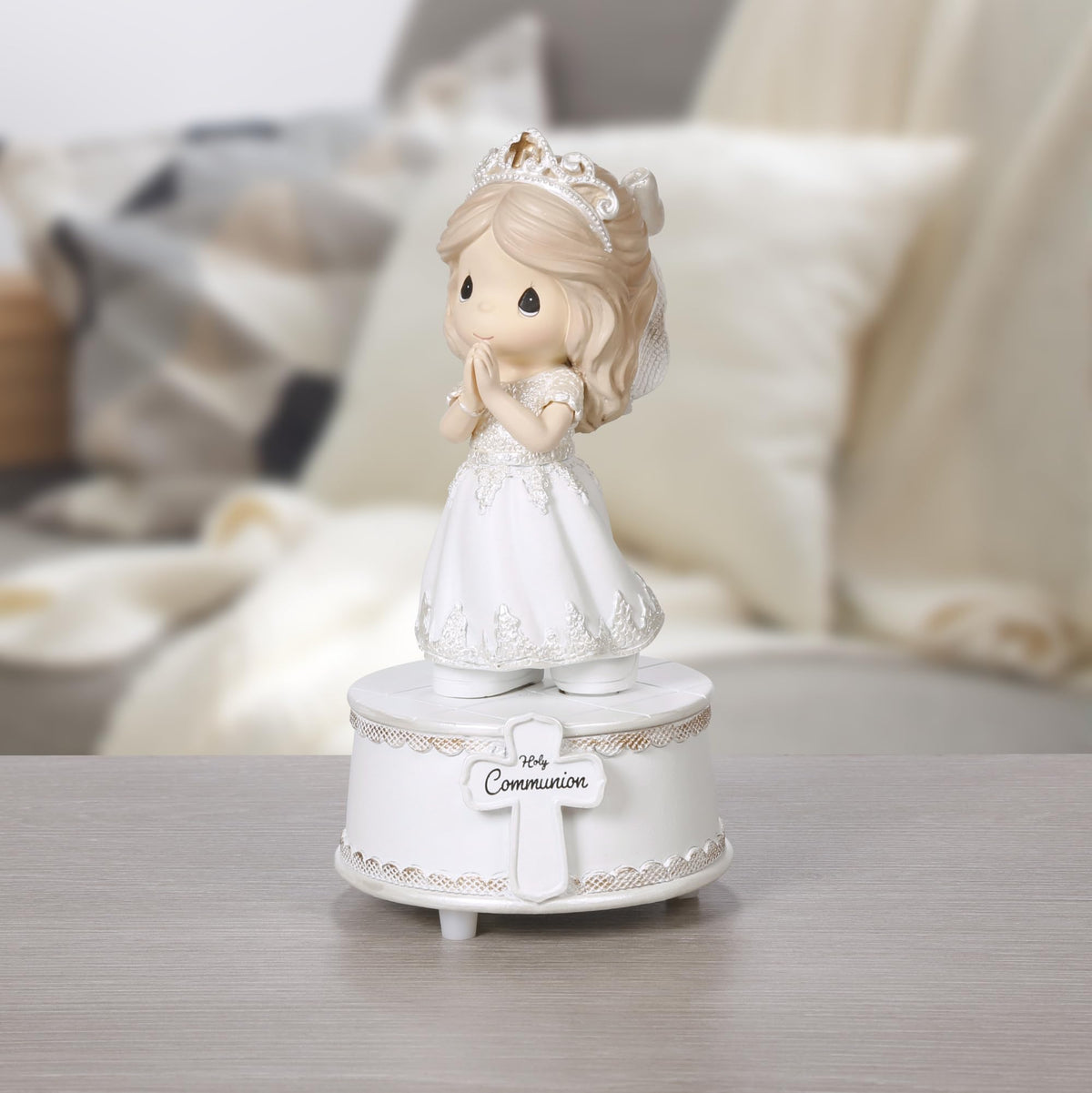 Precious Moments plays The Lord’s Prayer, enhancing the First Communion memory.