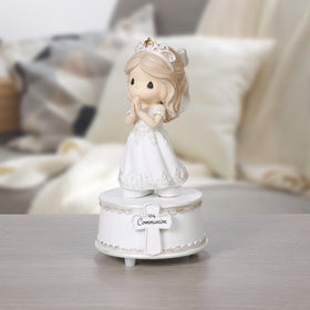 Precious Moments plays The Lord’s Prayer, enhancing the First Communion memory.