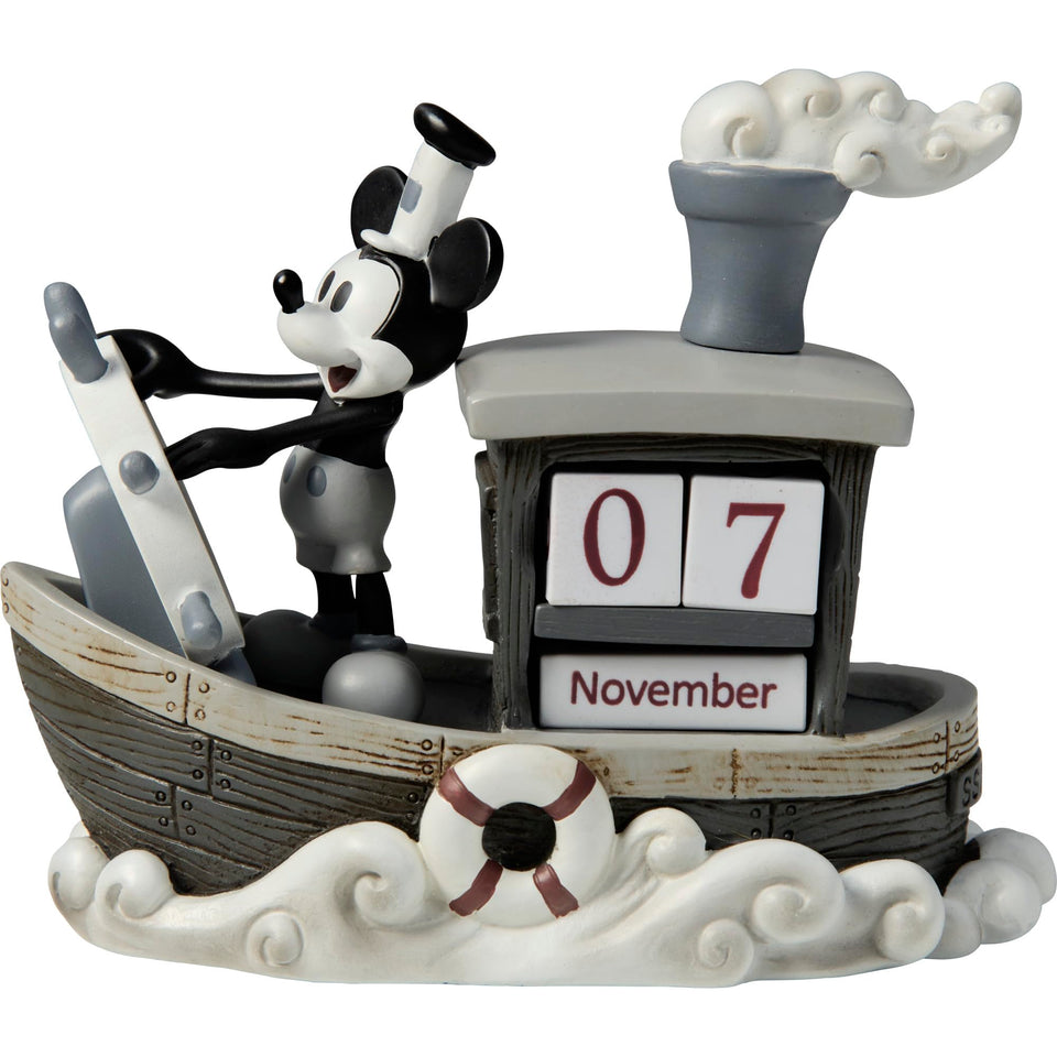 Precious Moments Mickey Endless Calendar Steamboat Willie figurine in nostalgic black-and-white display.