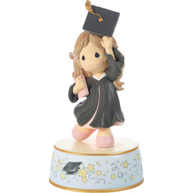 Precious Moments figurine plays Pomp and Circumstance for celebratory moments.