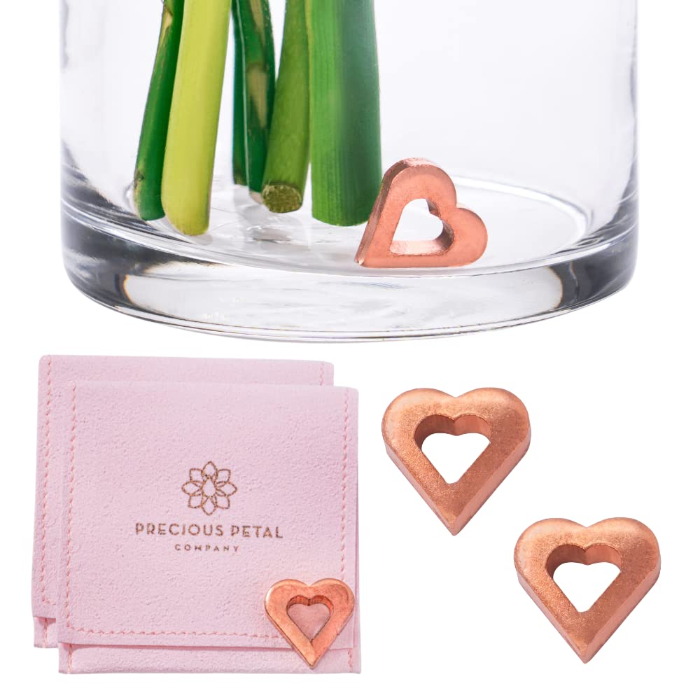 Precious Petal Co copper charm in a small vase keeps water clean