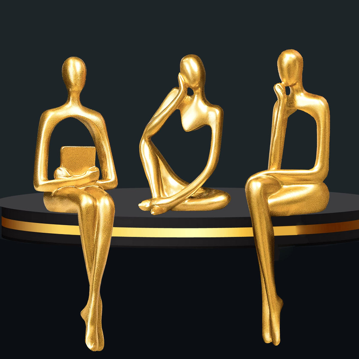 Prettidecor gold thinker trio on shelf enhances study ambiance