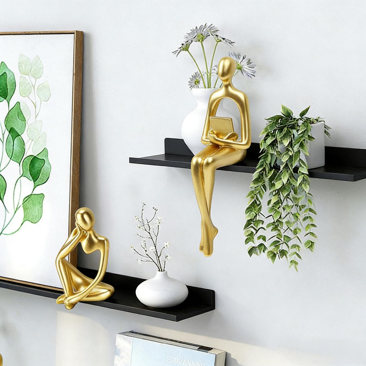 Prettidecor gold thinker sculpture on desk elevates style