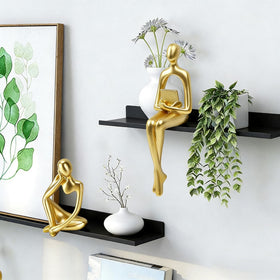 Prettidecor gold thinker sculpture on desk elevates style