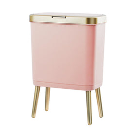 Procade pink trash can with lid and gold edge for stylish bathroom décor.