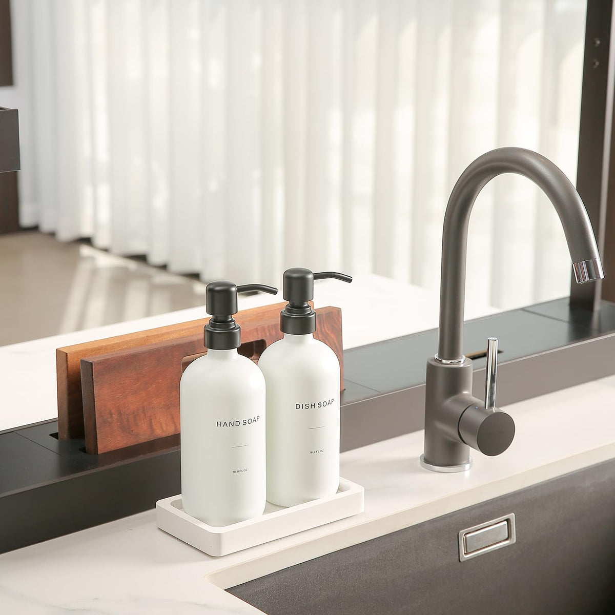 Prus Waso white dispenser with black pump simplifies soap use at the sink.