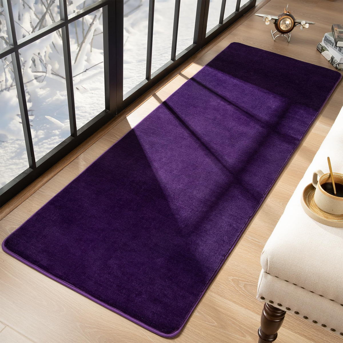 Przemy dark purple rug staged in bedroom decor for a warm ambiance.