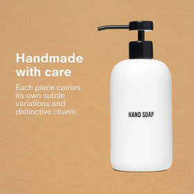 Public Goods black stainless pump variant on ceramic dispenser for sleek look.