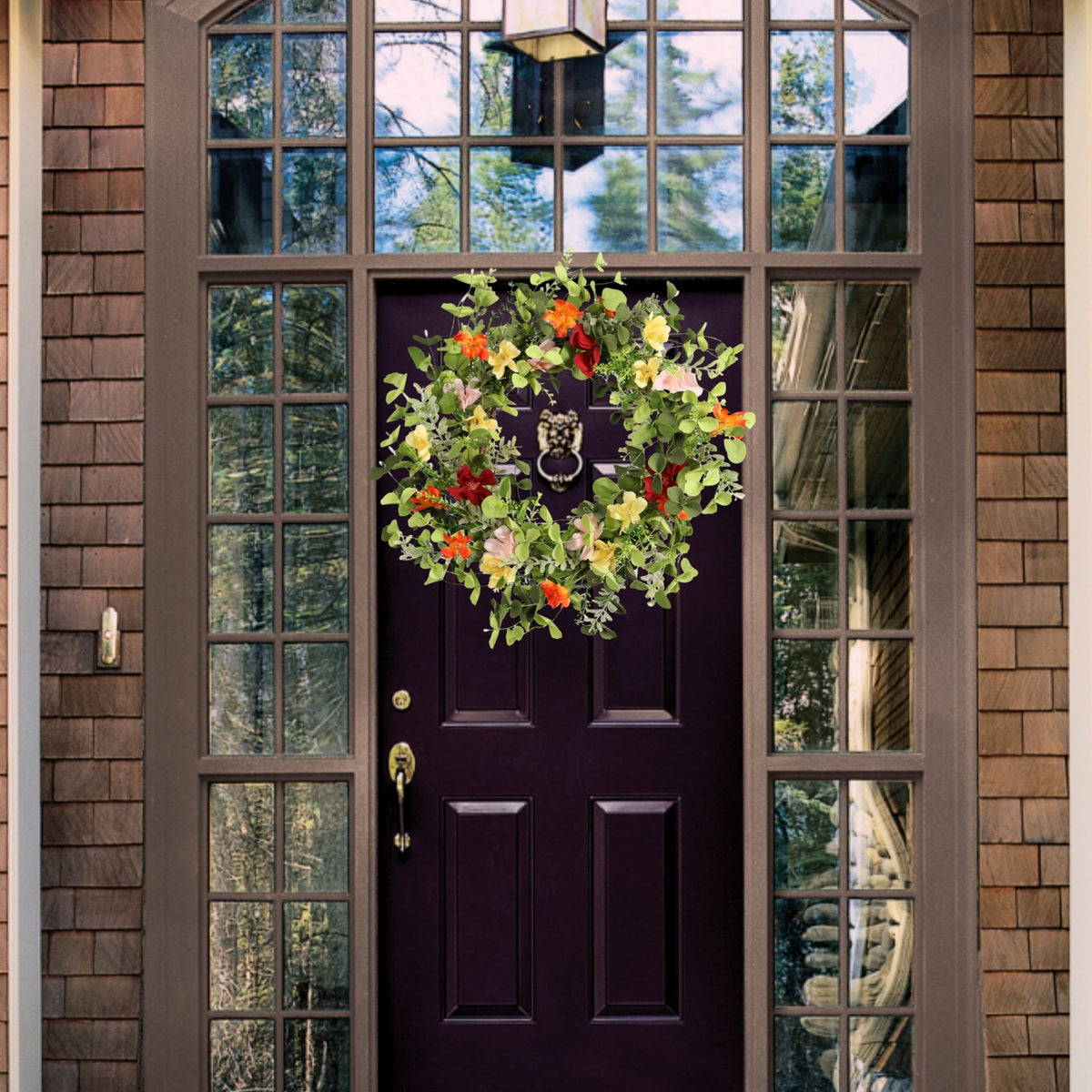Pudate wreath close-up berry accents for warm, festive ambiance.