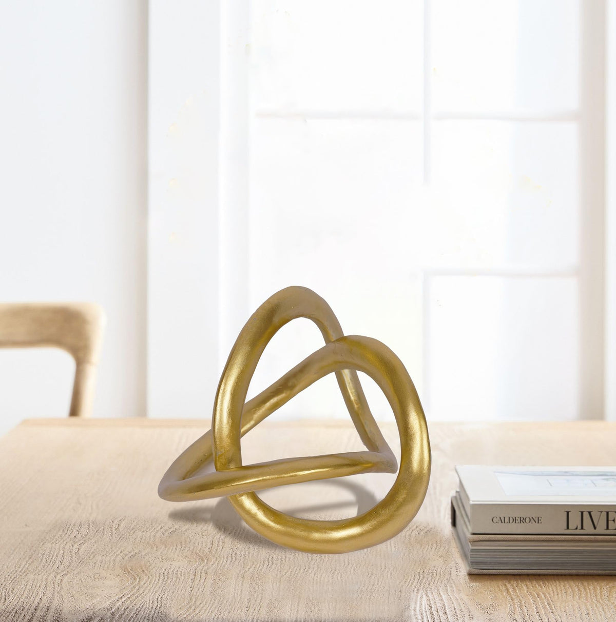 PUHOZN gold knot sculpture side angle adds geometric flair