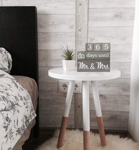 Pulse Brands engagement calendar in use on a bedside table to track wedding countdown
