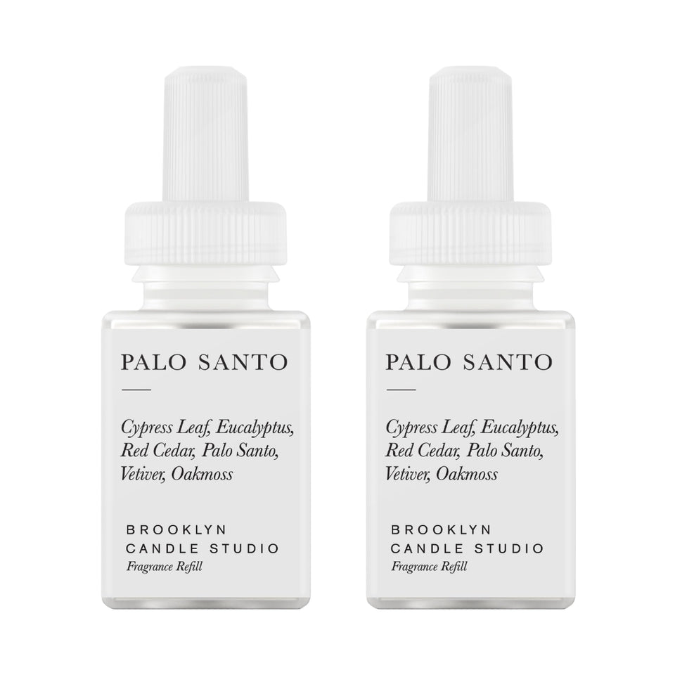 Pura Brooklyn Palo Santo refill bottle delivers long-lasting woody fragrance for shared spaces.