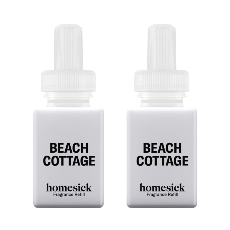 Pura Homesick Beach Cottage refill bottle highlights citrus notes for a bright room.