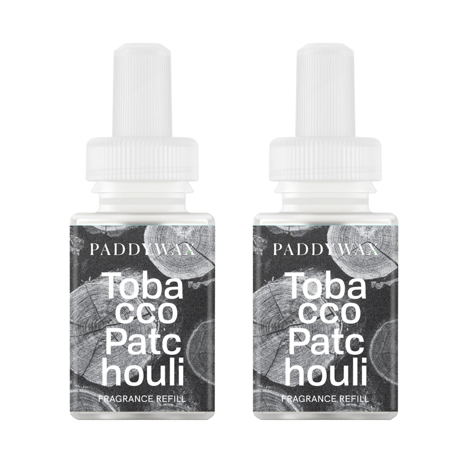 Pura Paddywax refill bottle close-up with tobacco-patchouli aromas.