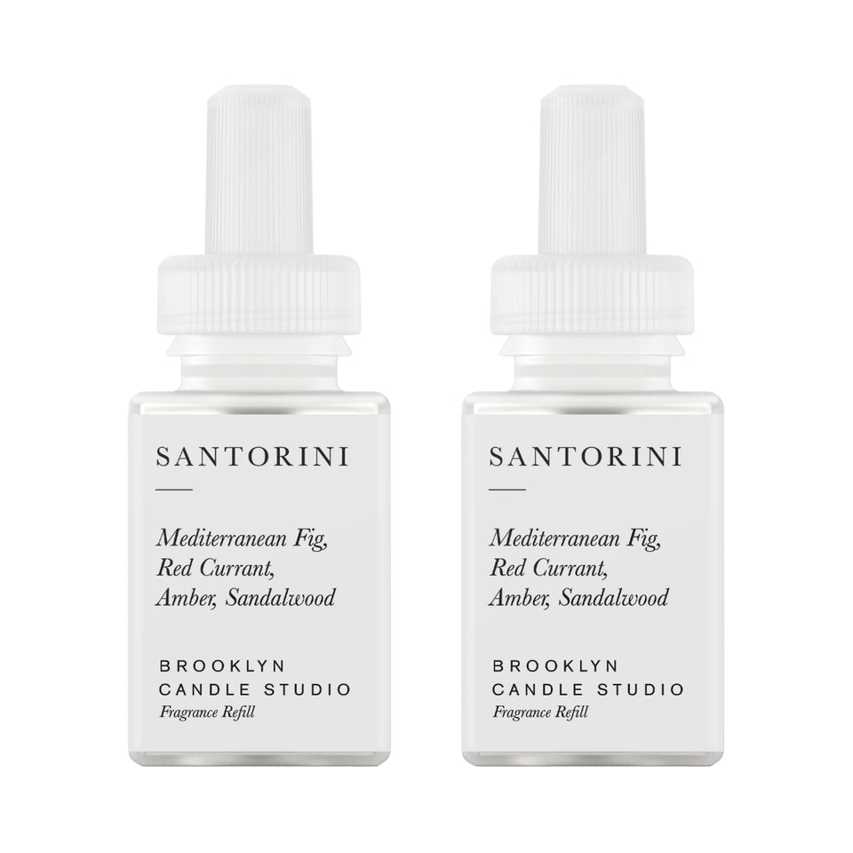 Pura Santorini refill bottle for smart diffuser, highlighting long-lasting fragrance.