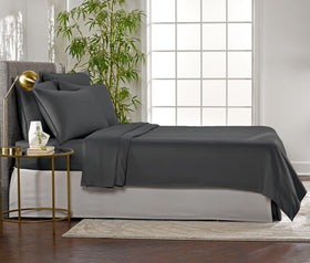 Pure Bamboo sheet set in charcoal packaged with care and safety certifications.