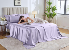 Pure Bamboo queen sheets lavender bed on white surface, cooling comfort for hot sleepers.