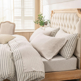 PURE ERA Jersey Knit sheets in Heather Beige on queen bed offer cloud-soft comfort and breathable warmth.