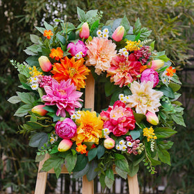 Close-up of PureCosy wreath showing vibrant dahlias and lush greens