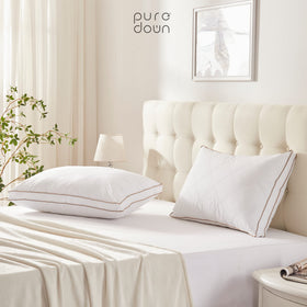 Puredown pillow close-up shows durable stitching and double fabric lining to prevent leakage.