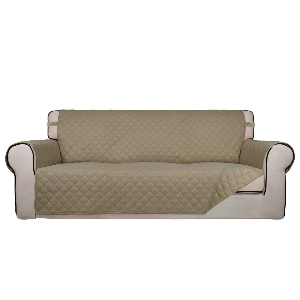 PureFit reversible quilted sofa cover in beige protects against spills and pet fur.