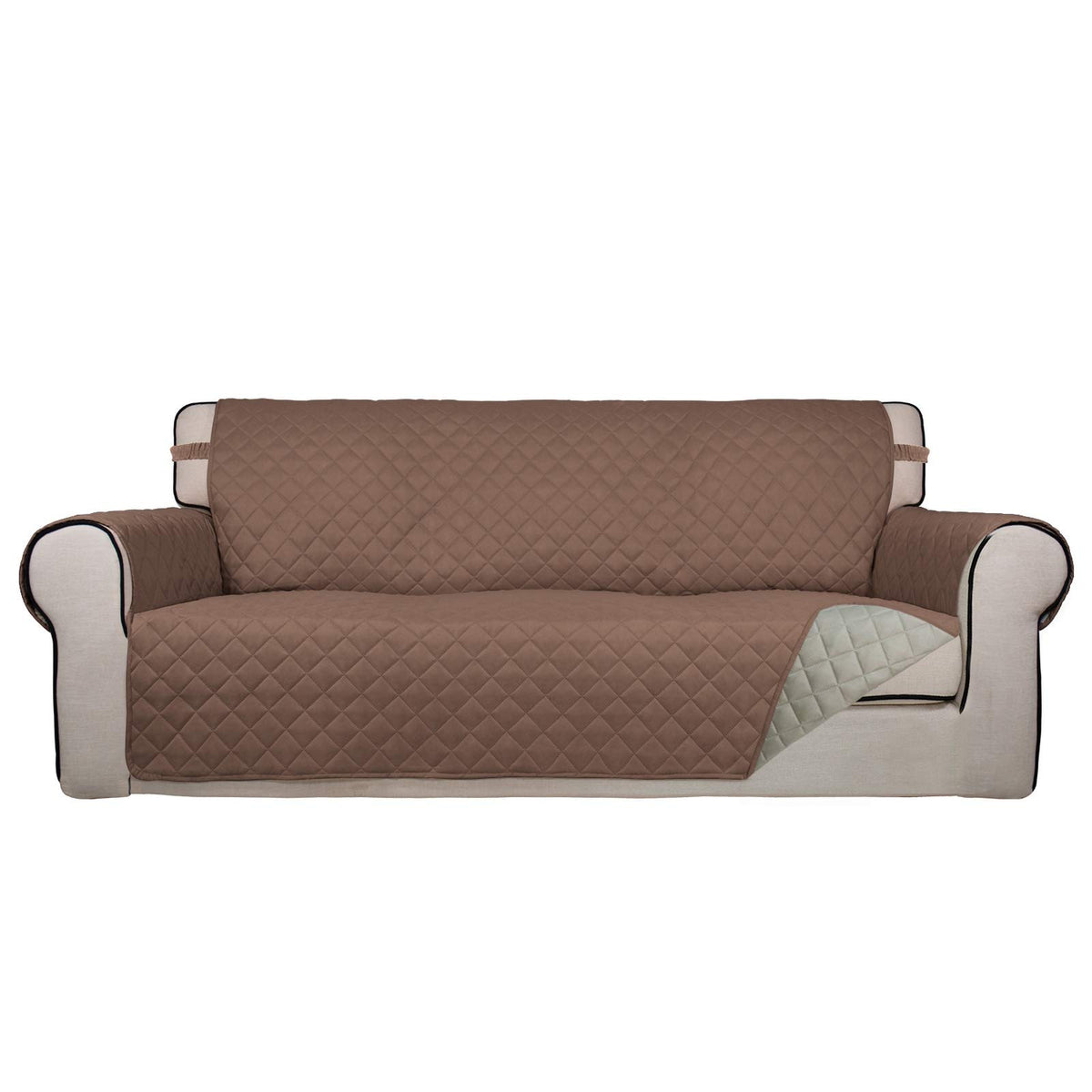 PureFit reversible quilted sofa cover in brown draped over a sofa for protection.