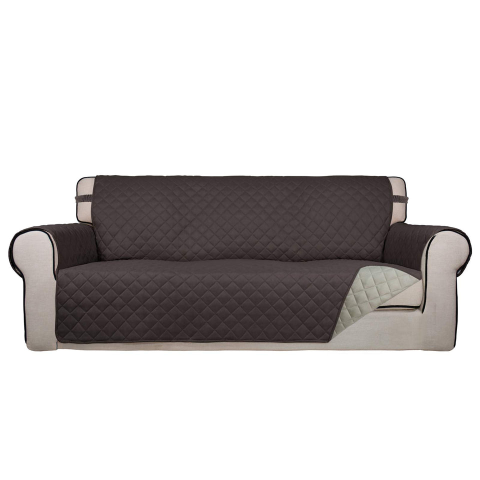 PureFit reversible quilted sofa cover in chocolate and beige protects upholstery from spills and fur.