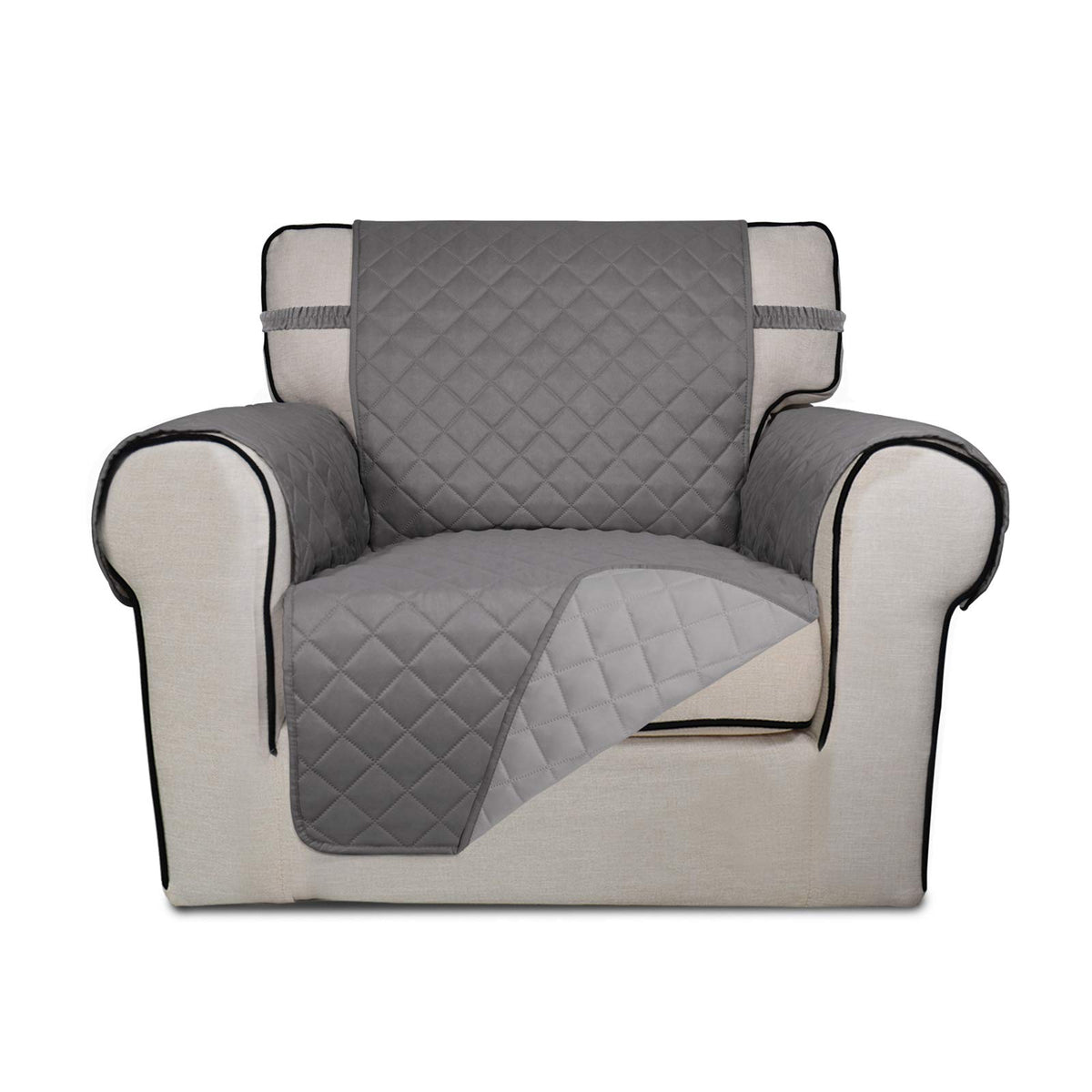 PureFit reversible quilted sofa cover draped on chair for protection
