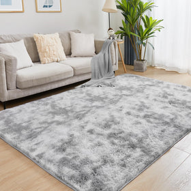Puremy ultra soft rug in tie-dyed light grey adds cozy warmth to living rooms.
