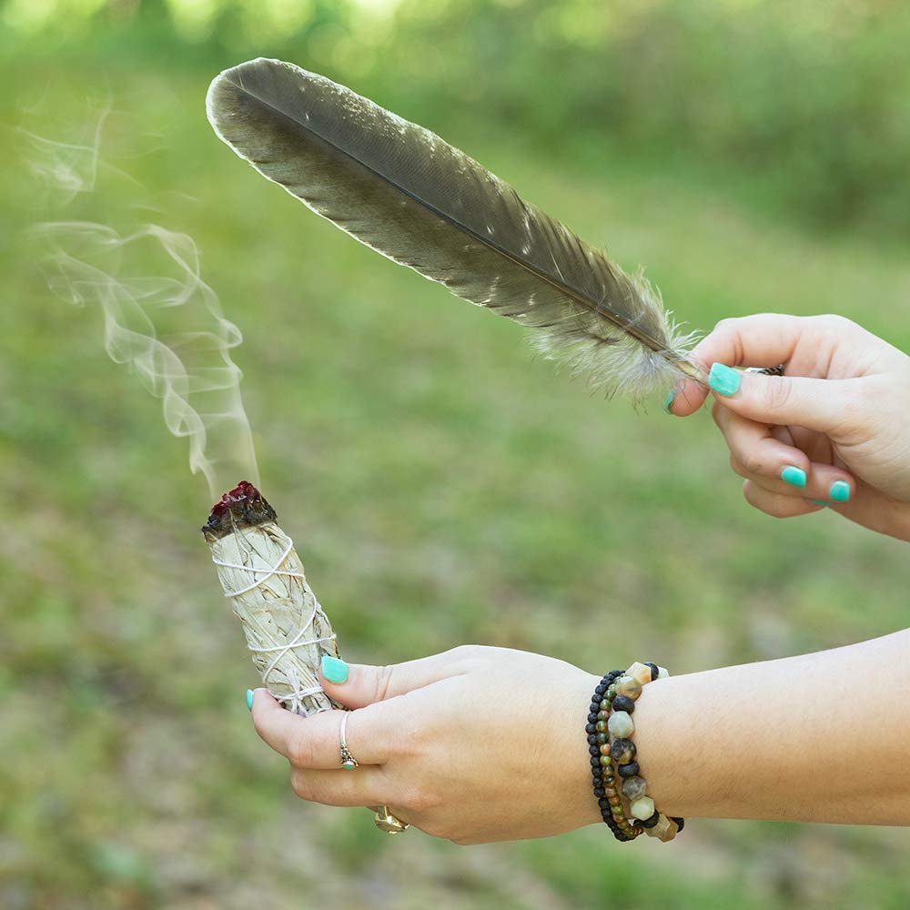 Purple Canyon smudge feather guiding the smoke during rituals