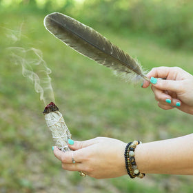Purple Canyon smudge feather guiding the smoke during rituals