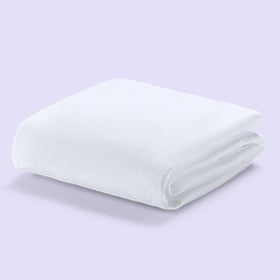 Purple Waterproof Mattress Protector top view with soft knit surface for quiet sleep.