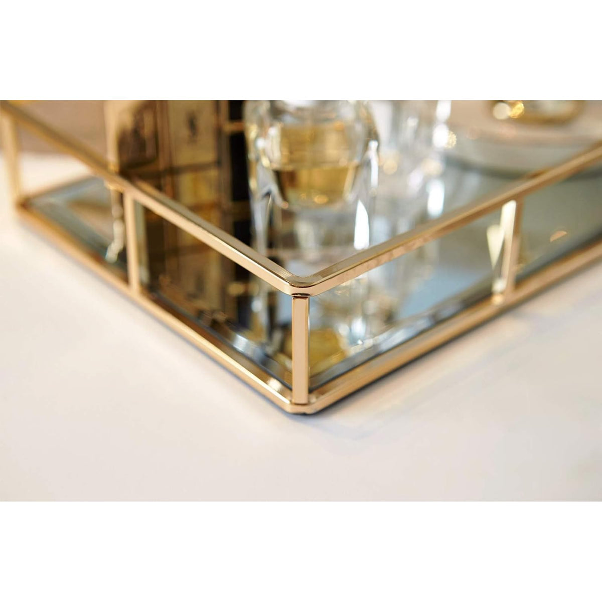 PuTwo Tray Mirror stores cosmetics and accessories on vanity.