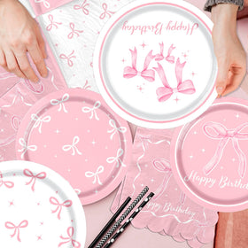 Pymurod pink bow banner brightens the party backdrop.