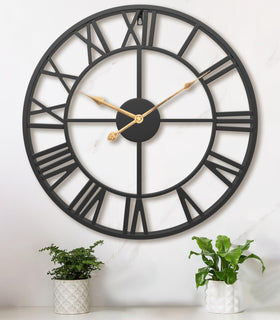 Pytha Sight 24-inch clock front view adds bold focal point to living room.