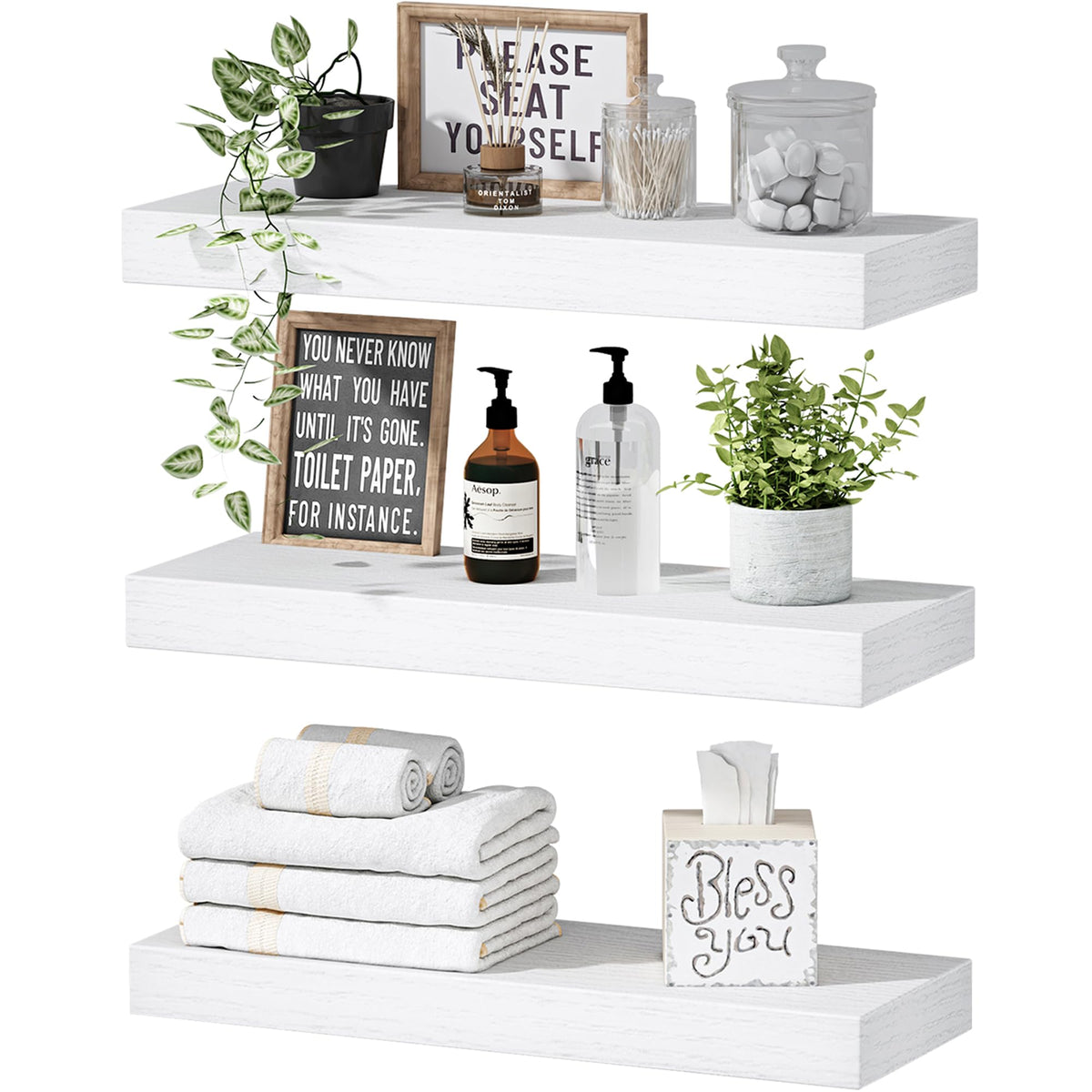 QEEIG white floating shelves mounted on wall displaying books and decor.