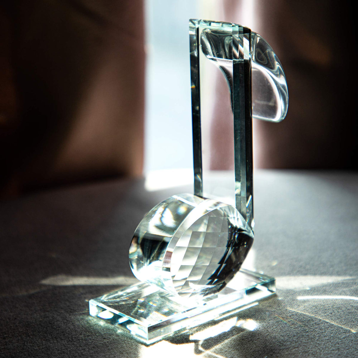 QFkris crystal eighth-note figurine on a bedside table for ambient glow