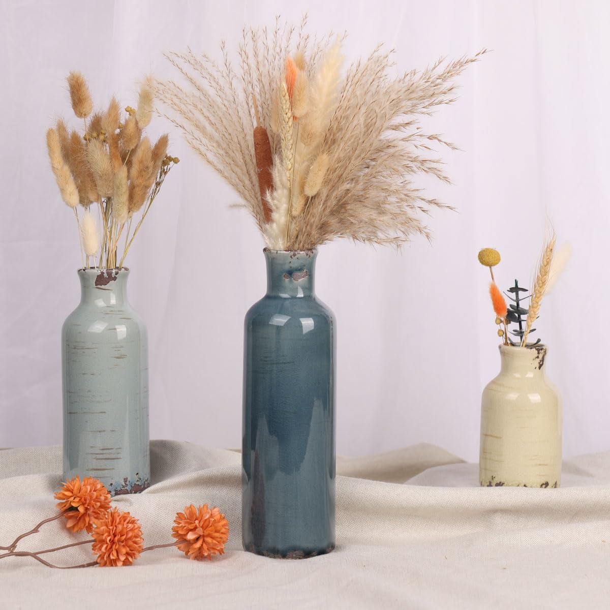 QIANLING vase set on shelf creates layered decor height.