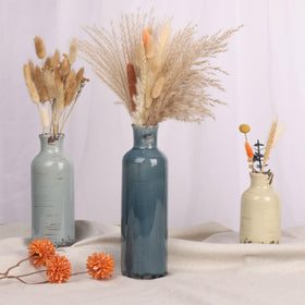 QIANLING vase set on shelf creates layered decor height.